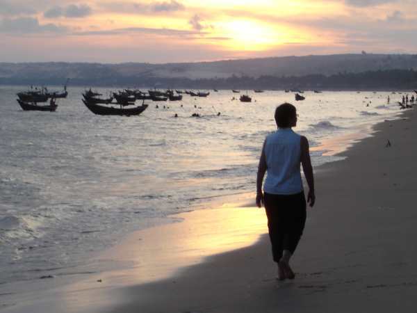 Strolling at sunset on Mui Ne Beach