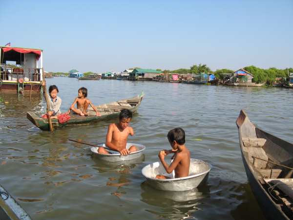 Kids at play in metal tubs